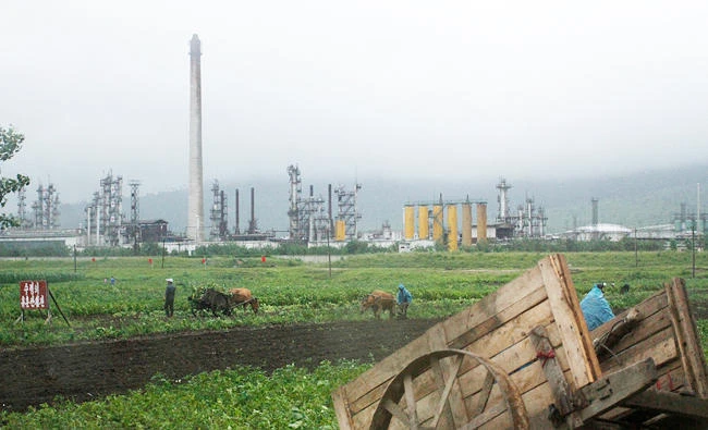 In this July 23, 2016 file photo, farmers work their fields outside the Sungri Chemical Factory, an oil refinery in the Rason Special Economic Zone near North Korea's Russian and Chinese borders that dates back to 1973 but has been idle in recent years. (AP)