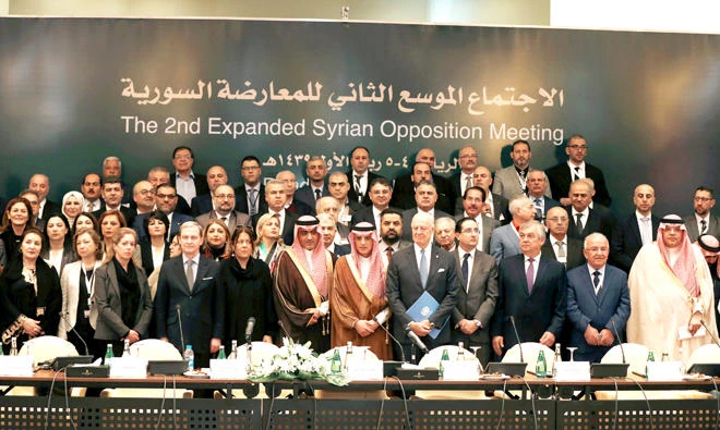 Saudi Foreign Minister Adel Al-Jubeir poses for a group photo during a Syrian opposition meeting in Riyadh on Wednesday. (Reuters)