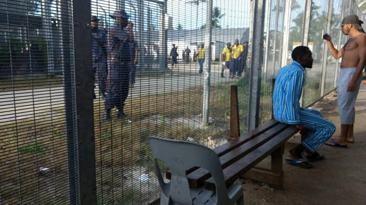 Police enter the Manus Island detention center on Manus Island, Papua New Guinea, on Thursday, November 23, 2017. (AAP/via REUTERS)