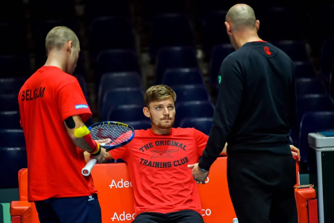 Belgium’s David Goffin (C) speak with Belgium’s Steve Darcis (L) and Belgium’s captain Johan Van Herck during a training session at the Pierre-Mauroy Stadium in Villeneuve d’Ascq on November 22, 2017, ahead of the Davis Cup World Group final between France and Belgium. (AFP/Philippe Huguen)