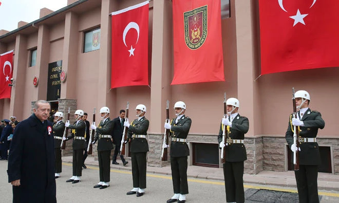 Turkey's President Recep Tayyip Erdogan inspects guard of honor as he arrives for a graduation ceremony at the War Academy, in Ankara, Thursday. (AP)