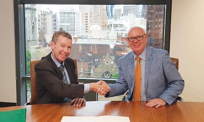 The signing took place between Ian Johnston, chief executive of the DFSA, and John Price, commissioner of ASIC. (Supplied)