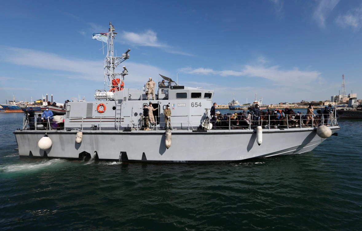 Libyan Navy boat with migrants on board arrives at navy base in Tripoli, Libya Nov. 23, 2017. (Reuters/Ismail Zitouny)