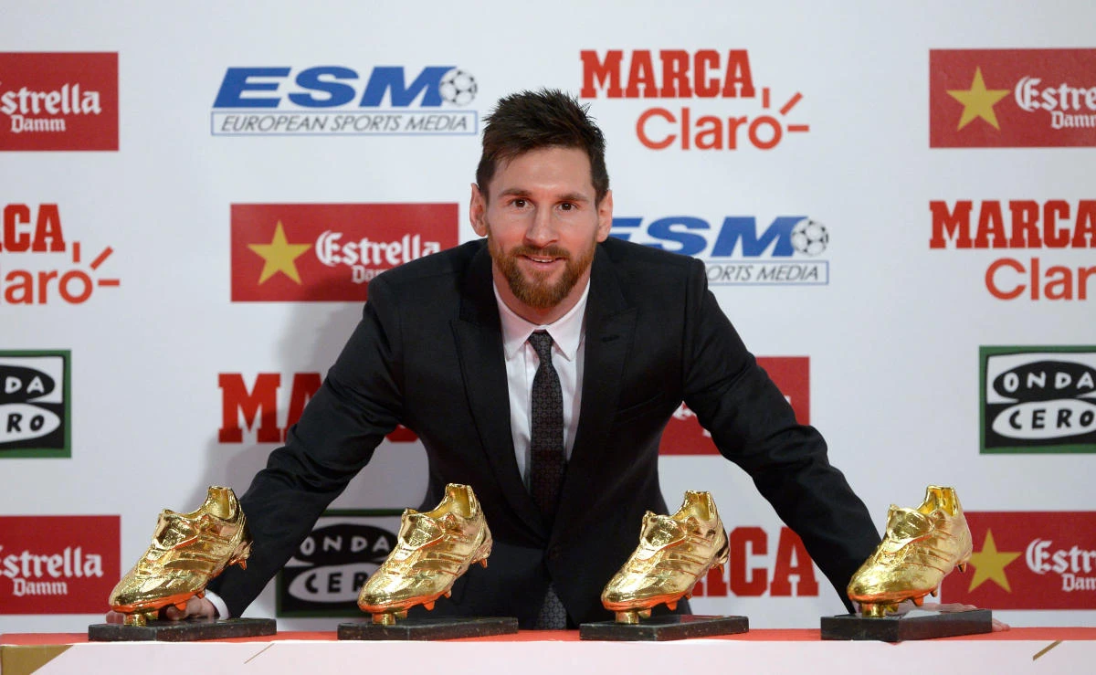 Barcelona’s Argentinian forward Lionel Messi poses with his four Golden Shoe awards after receiving the 2017 European Golden Shoe honoring the year’s leading goalscorer during a ceremony at the Antigua Fabrica Estrella Damm in Barcelona on November 24, 2017. (AFP)