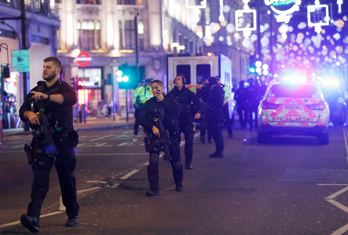 Armed police walk along Oxford Street, London. (Reuters)
