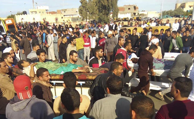 Injured people are evacuated from the scene of a militant attack on a mosque in Bir al-Abd in the northern Sinai Peninsula of Egypt on Friday, Nov. 24, 2017. (AP Photo)
