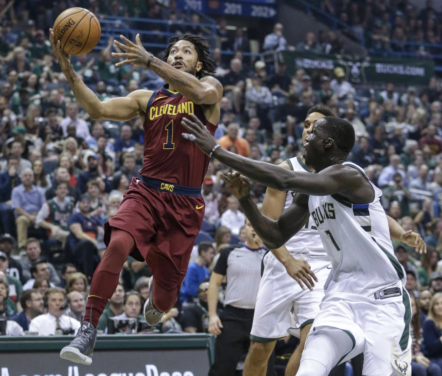 Above, Cleveland Cavaliers’ Derrick Rose drives to the basket against Milwaukee Bucks’ Thon Maker during their NBA previous match. (AP)