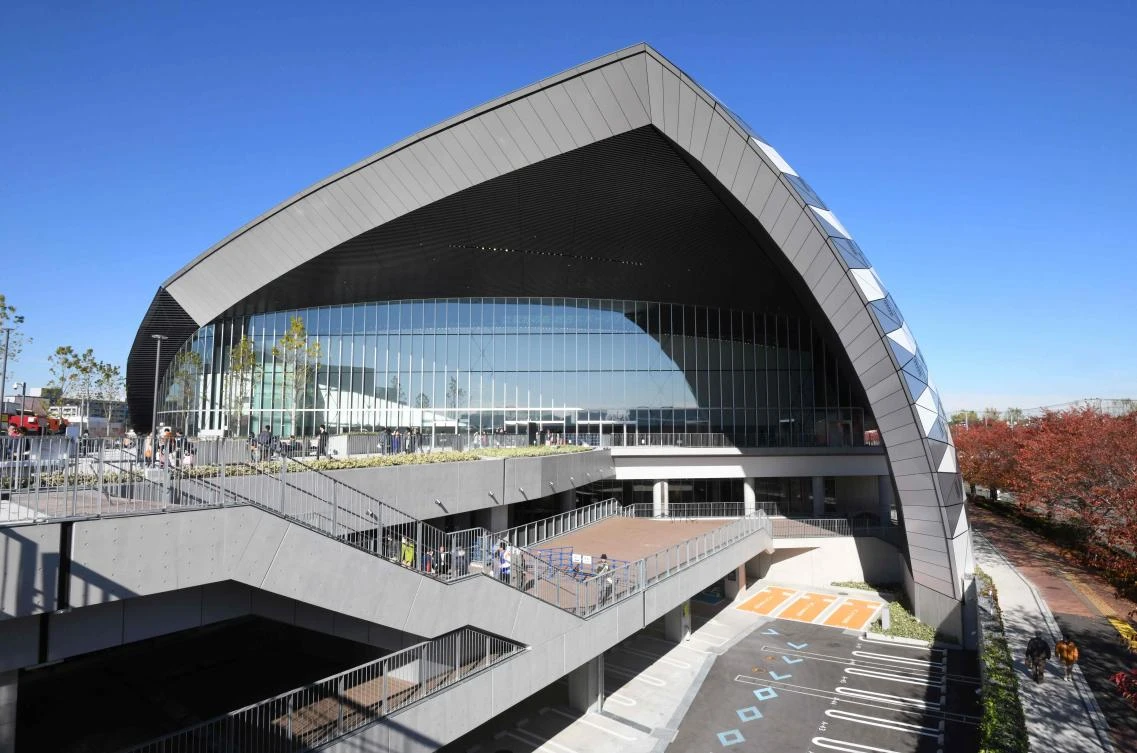 Above, the exterior of Musashino Forest Sports Plaza which opened in Tokyo on November 25, 2017. The new facility will host badminton and modern pentathlon fencing during the 2020 Tokyo Olympic Games and wheelchair basketball during the Paralympic Games. (AFP)