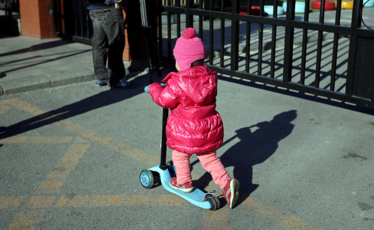 A child plays outside the kindergarten run by pre-school operator RYB Education Inc. being investigated by China’s police, in Beijing, China on November 24, 2017. (REUTERS)