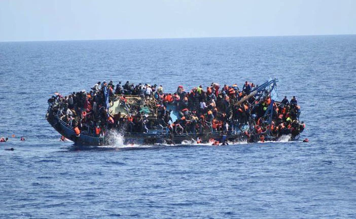 Migrants are seen on a capsizing boat before a rescue operation by Italian navy ships “Bettica” and “Bergamini” (unseen) off the coast of Libya in this handout picture released by the Italian Marina Militare on May 25, 2016. (File photo: Marina Militare/Handout via Reuters)