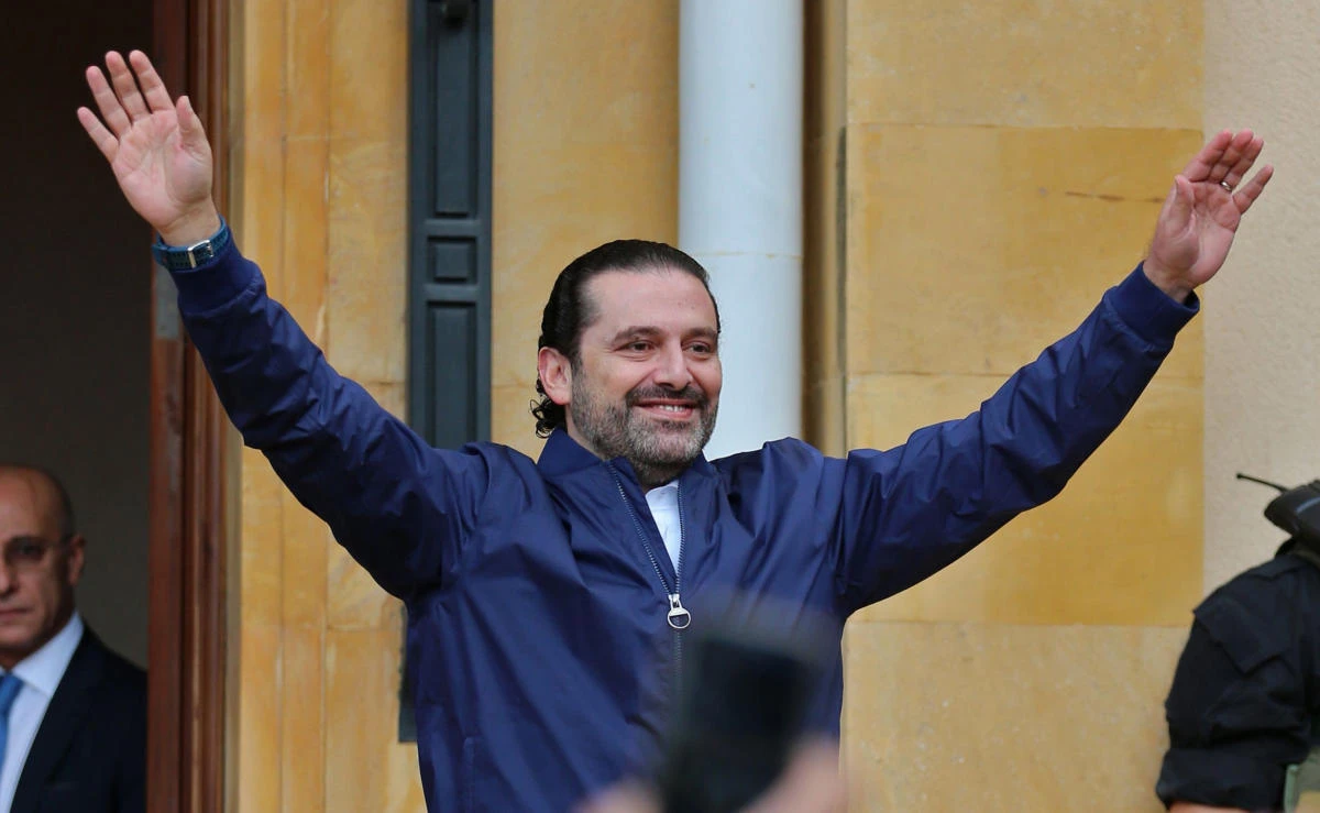Lebanese prime minister Saad Hariri greets his supporters upon his arrival at his home in Beirut on November 22, 2017. (AFP)