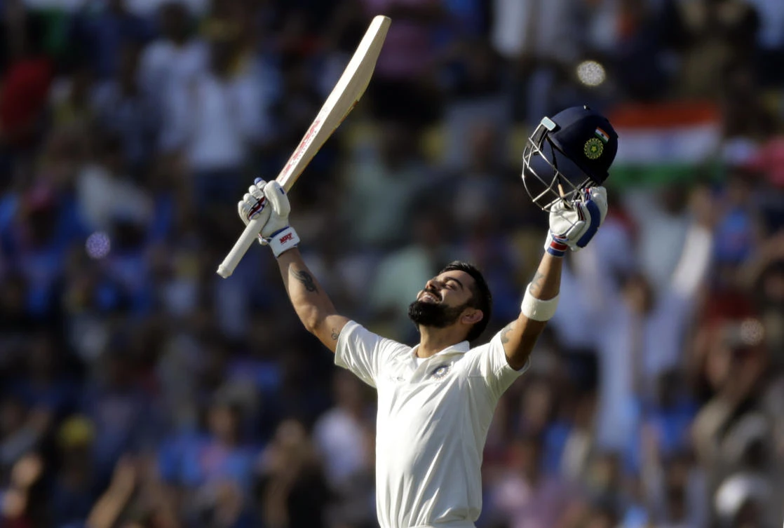 India’s captain Virat Kohli looks skywards as he celebrates scoring double century during the third day of their second test cricket match against Sri Lanka in Nagpur, India, on Sunday, November 26, 2017. (AP)