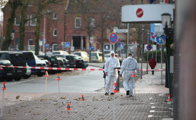 Police investigators look for traces after an apparently intoxicated man has driven a car into pedestrians in northern Germany city of Cuxhaven on Sunday morning, Nov. 26, 2017. (Jens Potschka/Cuxhavener Nachrichten/dpa via AP)