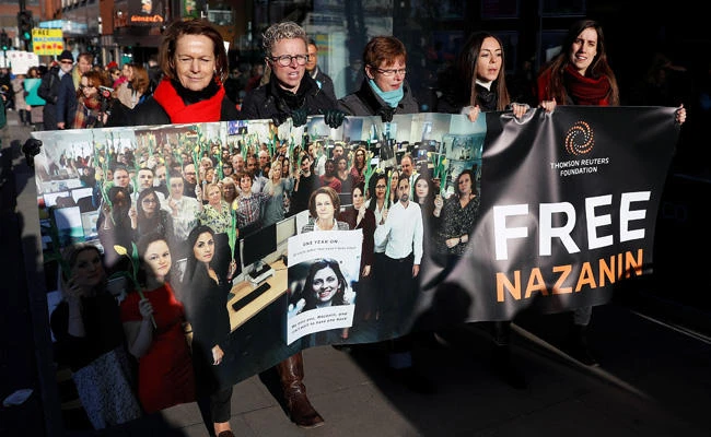 Thomson Reuters Foundation staff take part in a march in London on Nov. 25, 2017 in support of Nazanin Zaghari-Ratcliffe, the British-Iranian mother who is in jail in Iran. (REUTERS/Peter Nicholls)