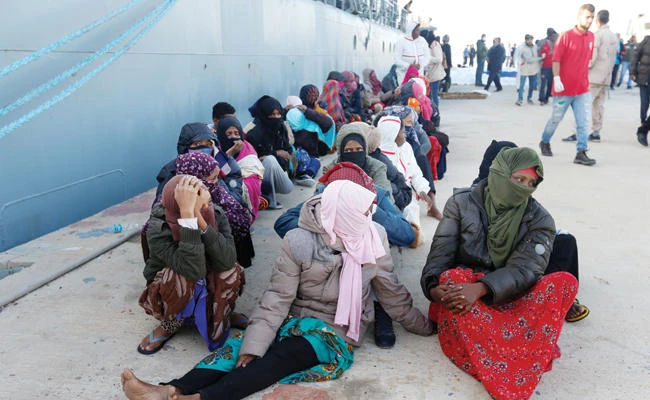 Migrants arrive at a naval base in Tripoli after they were rescued by Libyan coastal guards on Saturday. (Reuters)