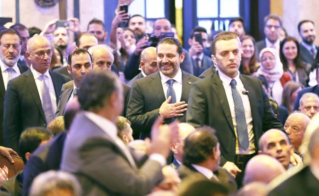 Lebanese Prime Minister Saad Hariri greets the audience during a regional banking conference in Beirut recently. (AP)