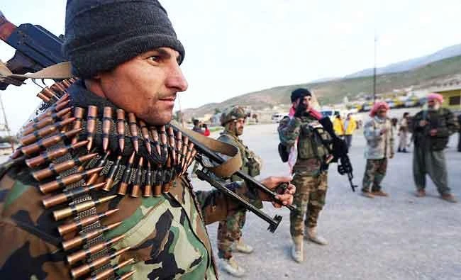 Fighters of Kurdish Peshmerga forces get ready for an operation in the city of Sinjar, in this December 20, 2014 file photo, at the Mount Sinjar, south-west of the northern Iraqi city of Mosul. (AFP)