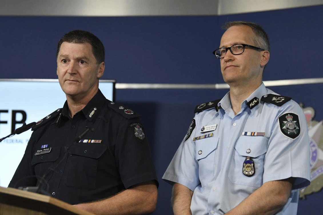 Australian Federal Police, Acting Deputy Commissioner Ian McCartney, right, and Victoria State Police Deputy Commissioner Shane Patton address the media at the Victorian Police Center in Melbourne Tuesday, Nov. 28, 2017. Australian police have arrested a man accused of planning a mass shooting for New Year’s Eve in a crowded Melbourne square, officials said on Tuesday. (James Ross/AAP Image via AP)