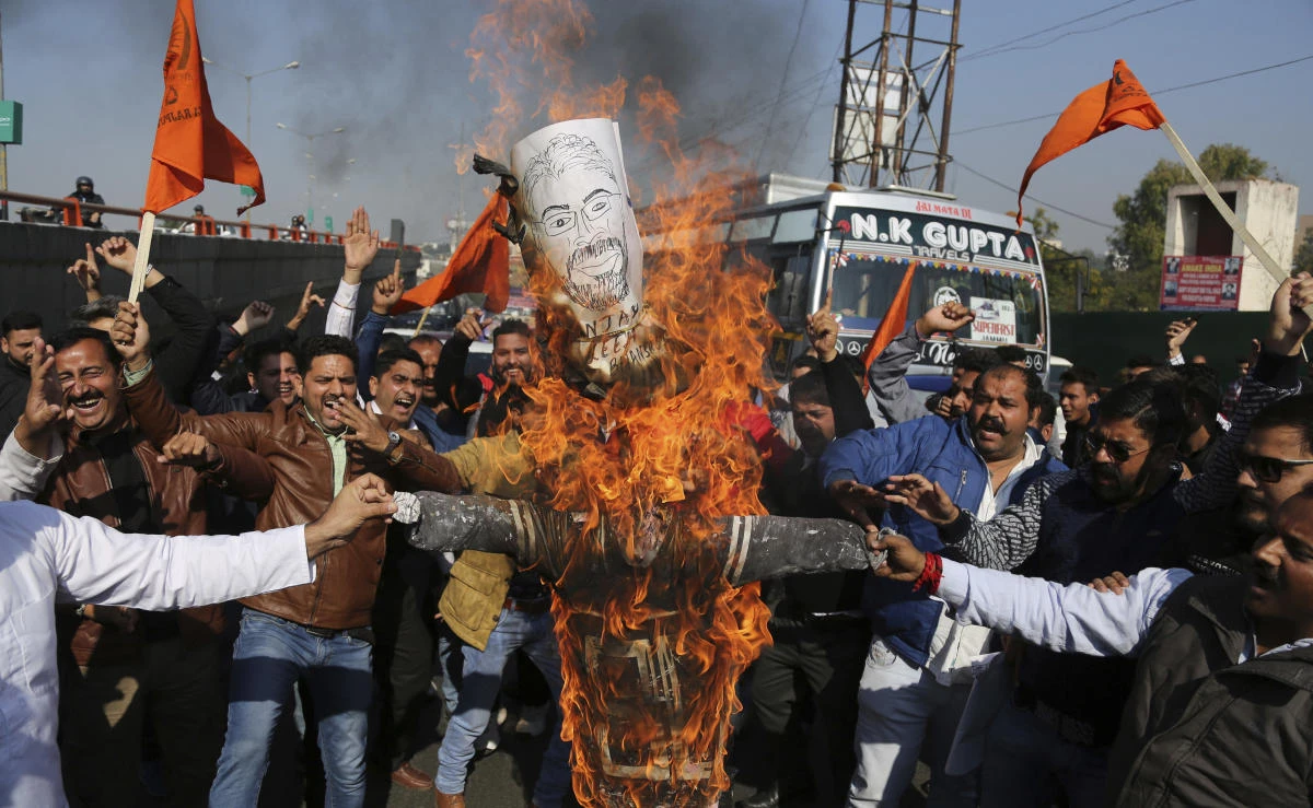 Members of India’s Rajput community burn an effigy of film director Sanjay Leela Bhansali and shout slogans as they protest against the release of Bollywood film “Padmavati” in Jammu, India, on Friday, November 24, 2017. (AP)