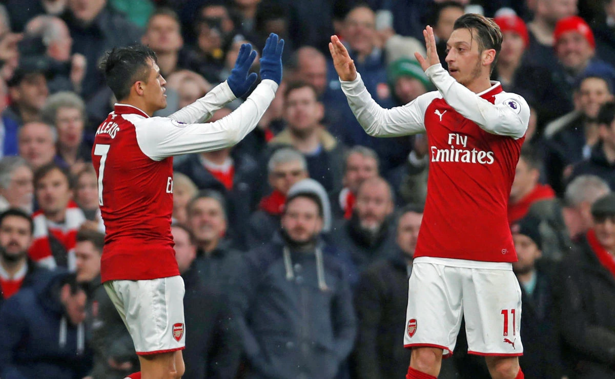 Arsenal’s Alexis Sanchez celebrates scoring their second goal with Mesut Ozil on November 18, 2017. (File photo: Action Images via Reuters)