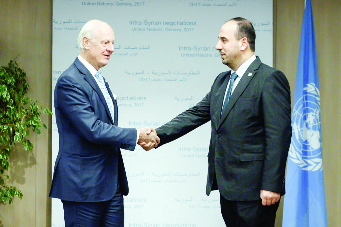 UN Special Envoy for Syria Staffan de Mistura and head of the Syrian Negotiation Commission Nasr Hariri meet in Geneva on Tuesday. (Reuters)