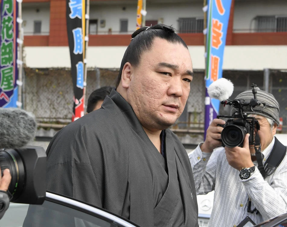 In this Tuesday, Nov. 14, 2017, photo, Mongolian sumo grand champion Harumafuji leaves after visiting wrestler Takanoiwa’s stable master’s quarters in Tagawa, southwestern Japan. (AP)