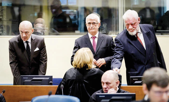 From left: Former Croatian Prime Minister Jadranko Prlic, former Bosnian Croat Defense Minister Bruno Stojic and former Croatian general Slobodan Praljak are pictured prior to the judgement in their appeals case, at The Hague on Wednesday. (AFP)