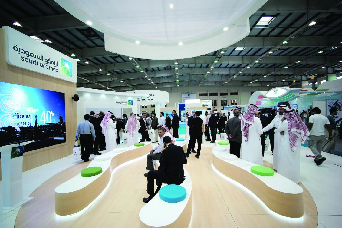 Visitors are seen at the Saudi Aramco stand at an exhibition in Manama. The oil giant has become increasingly active in startup funding. (Reuters)