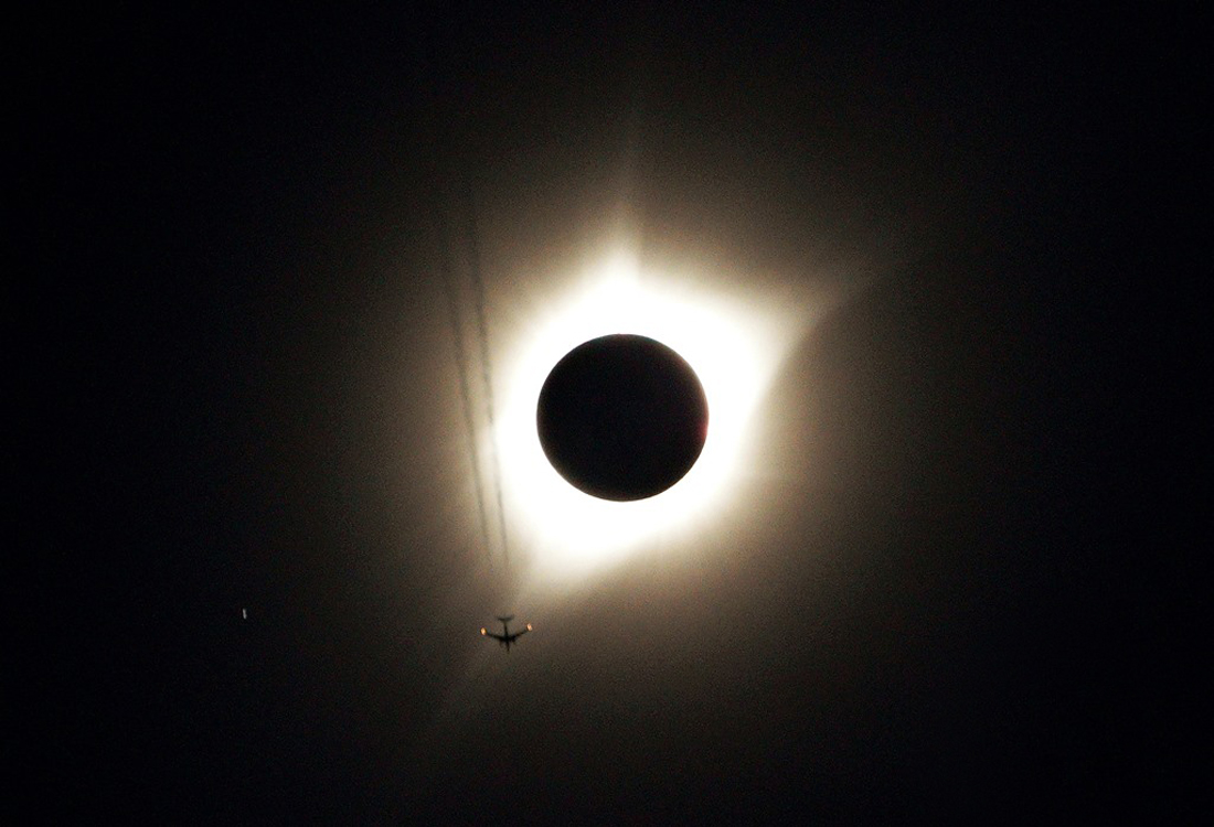 21 August — A jet plane flies by the total solar eclipse, dubbed "The Great American Eclipse" by the media, in Guernsey, Wyoming. (REUTERS)