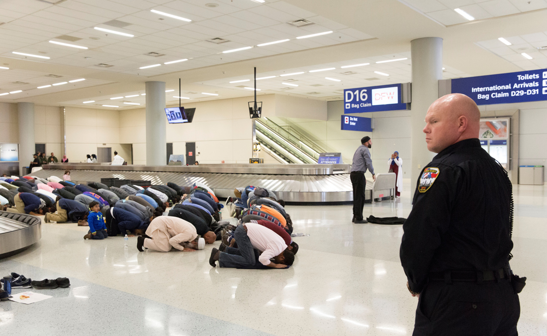 January 29, 2017 — People gather to pray in baggage claim during a protest against President Trump's ban on the immigration, at Dallas/Fort Worth International Airport in Texas. (REUTERS)