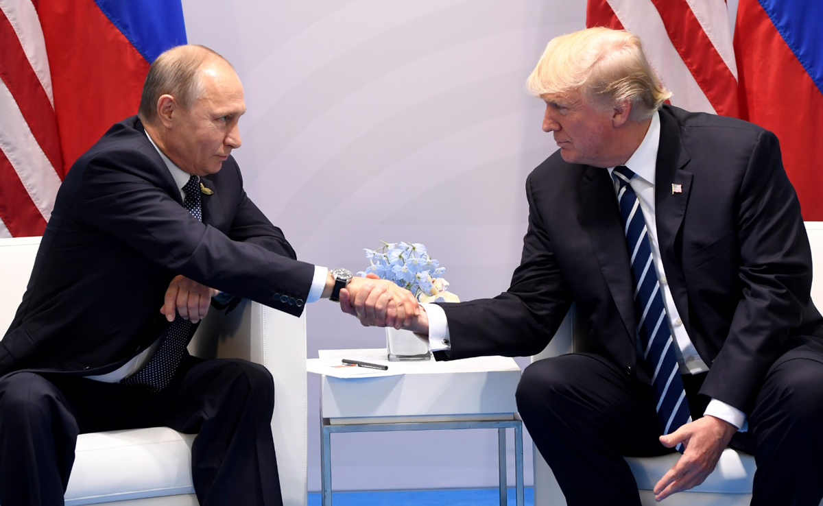 July 7, 2017 — US President Donald Trump and Russia's President Vladimir Putin shake hands during a meeting on the sidelines of the G20 Summit in Hamburg, Germany. (AFP)
