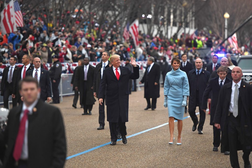 January 20, 2017 — US President Donald Trump and First Lady Melania walk the inaugural parade route with son Barron, right, on Pennsylvania Avenue in Washington, DC. (AFP)