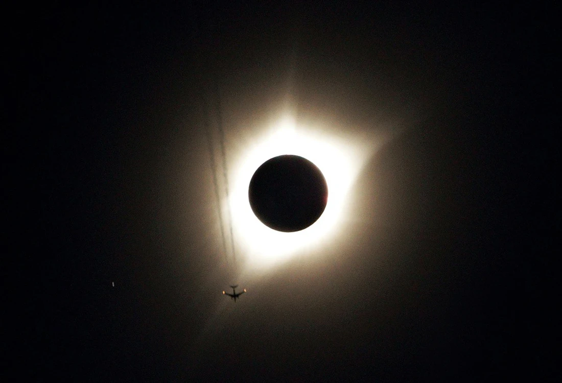 21 August — A jet plane flies by the total solar eclipse, dubbed "The Great American Eclipse" by the media, in Guernsey, Wyoming. (REUTERS)