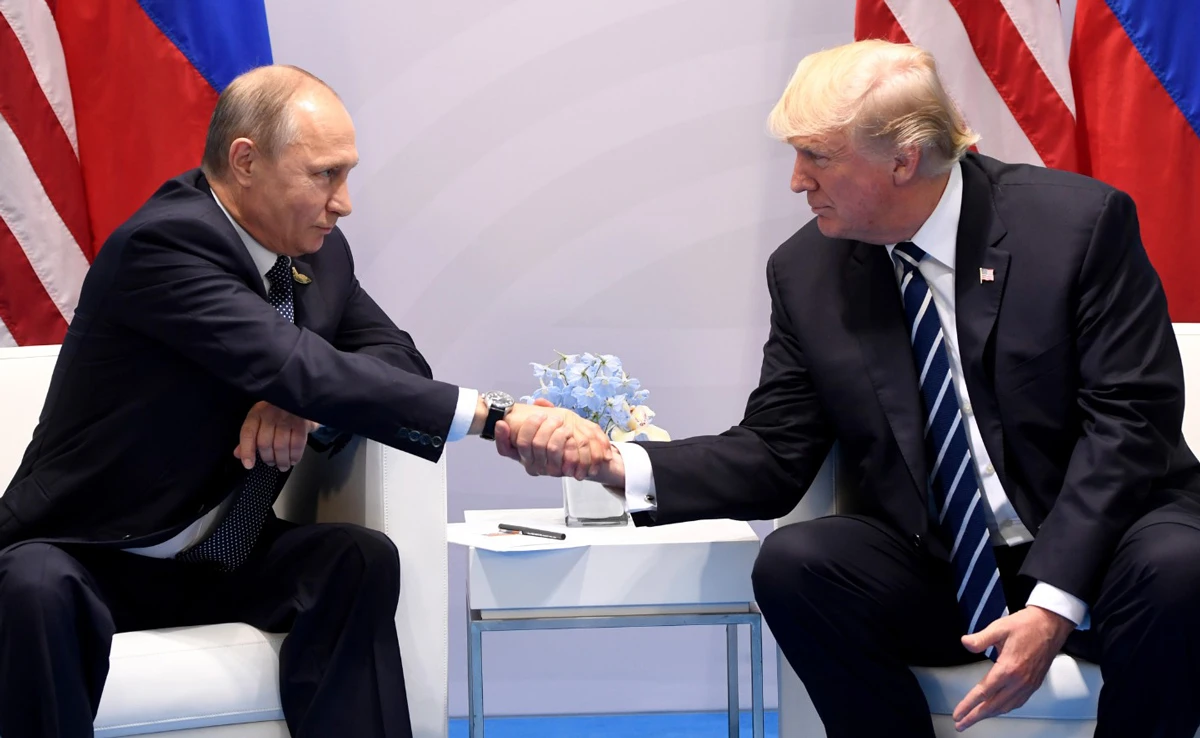 July 7, 2017 — US President Donald Trump and Russia's President Vladimir Putin shake hands during a meeting on the sidelines of the G20 Summit in Hamburg, Germany. (AFP)