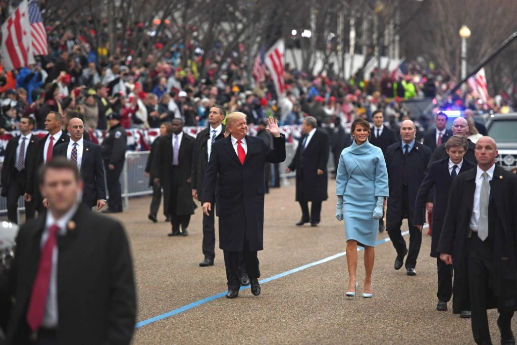 January 20, 2017 — US President Donald Trump and First Lady Melania walk the inaugural parade route with son Barron, right, on Pennsylvania Avenue in Washington, DC. (AFP)