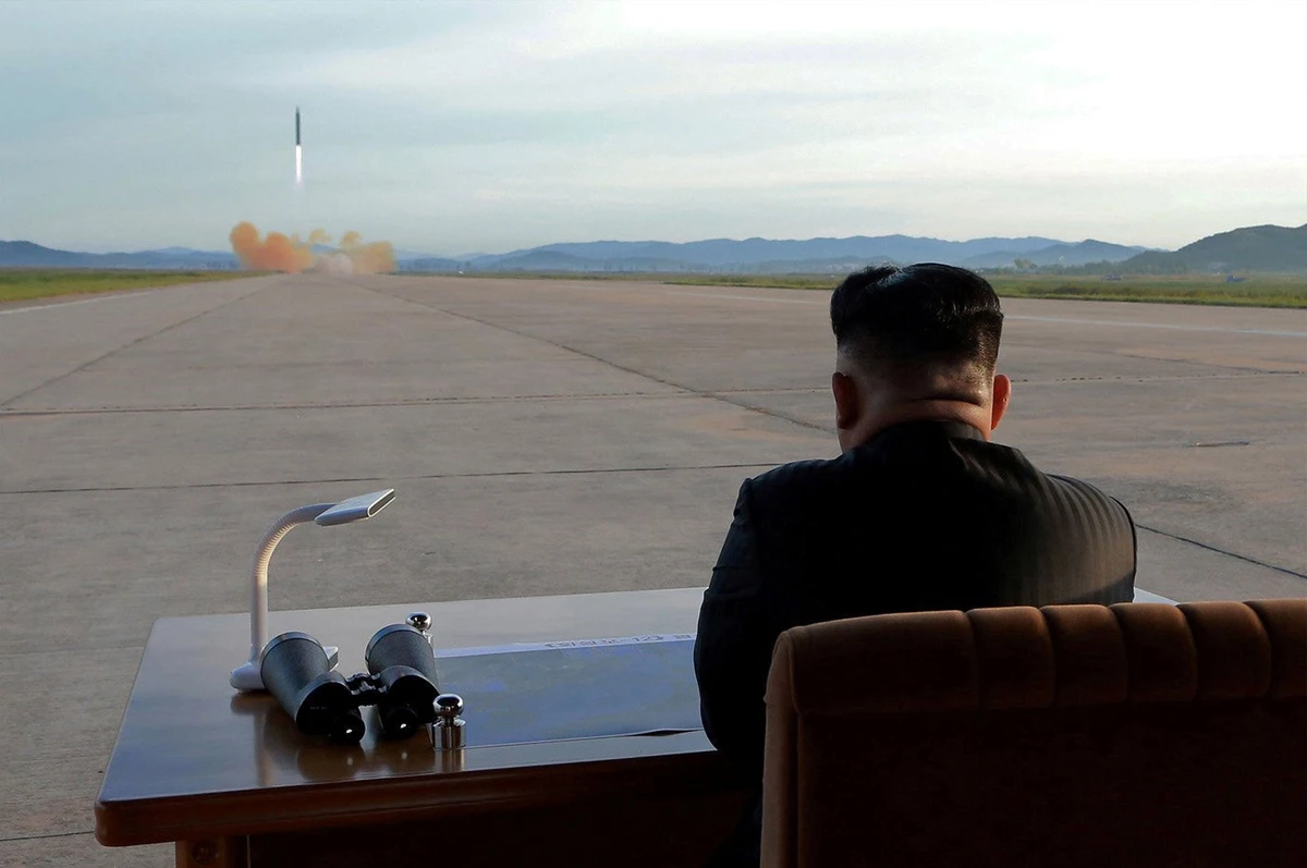 September 16, 2017 — North Korean leader Kim Jong Un watches the launch of a Hwasong-12 missile. (KCNA via REUTERS)