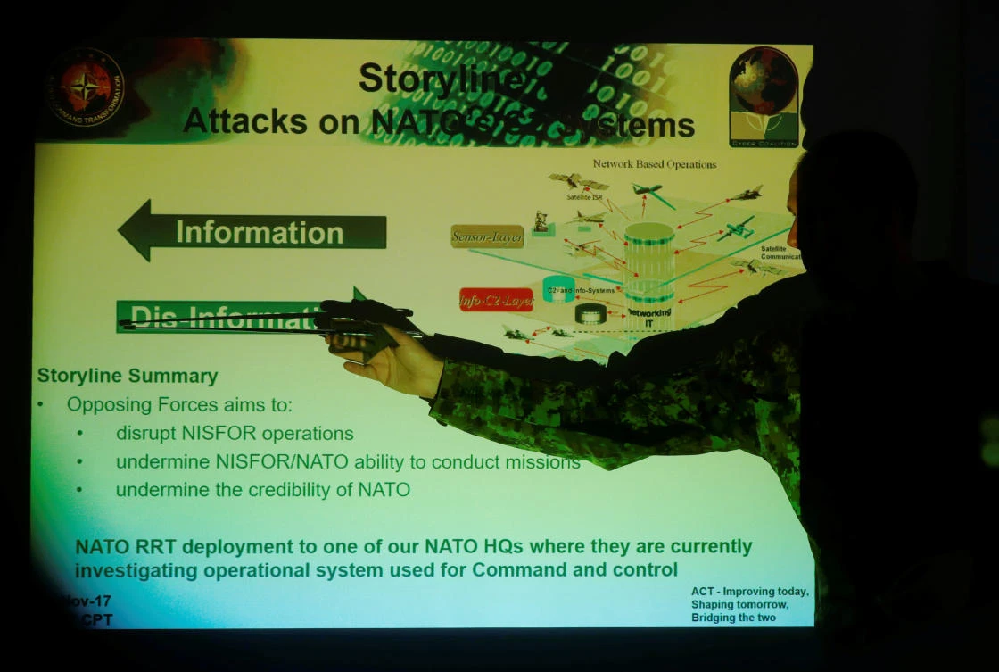 A military specialist presents the NATO Cyber Coalition exercise in Tartu, Estonia, on November 29, 2017. (REUTERS/Ints Kalnins)
