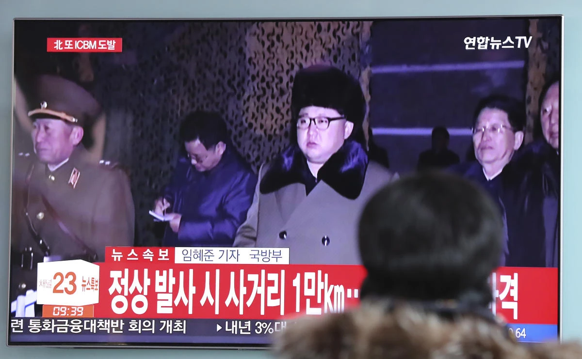 A woman watches a local news program, reporting about North Korea’s missile launch with a file footage of North Korean leader Kim Jong Un, at the Seoul Railway Station in Seoul early this week. (AP)