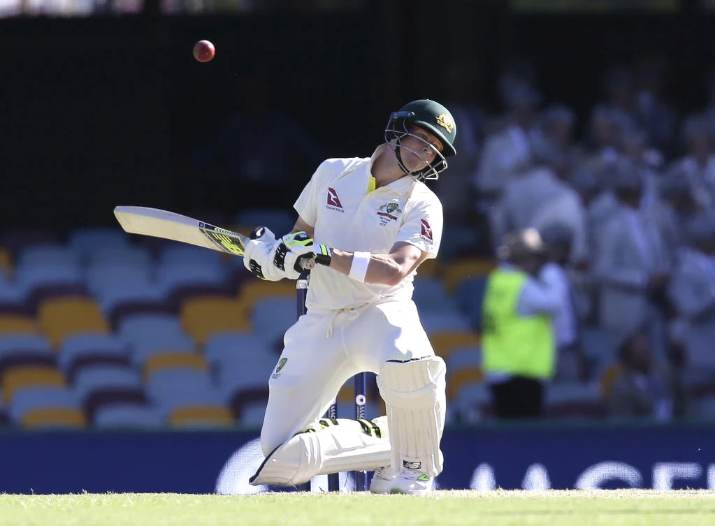 Australia’s Steve Smith ducks under a bouncer during the Ashes cricket test between England and Australia in Brisbane, Australia, Friday, Nov. 24, 2017. (AP Photo/Tertius Pickard)
