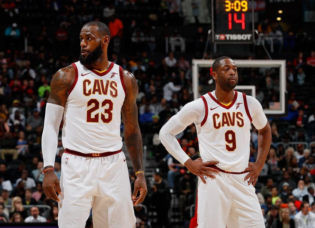 LeBron James #23 and Dwyane Wade #9 of the Cleveland Cavaliers look on during the game against the Atlanta Hawks at Philips Arena on Nov. 30, 2017 in Atlanta, Georgia. Kevin C. Cox/Getty Images/AFP)