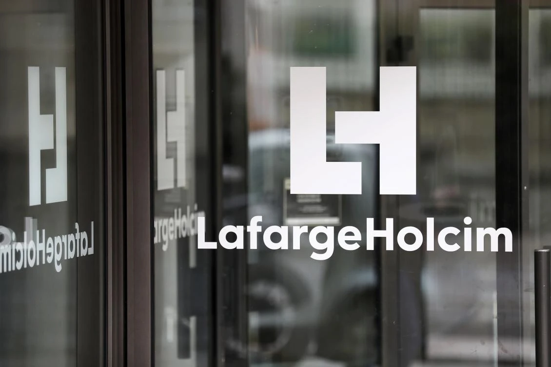 A logo at an entrance of the French headquarters of LafargeHolcim, a group created in 2015 by the merger of French cement manufacturer Lafarge and its Swiss counterpart Holcim. (AFP)