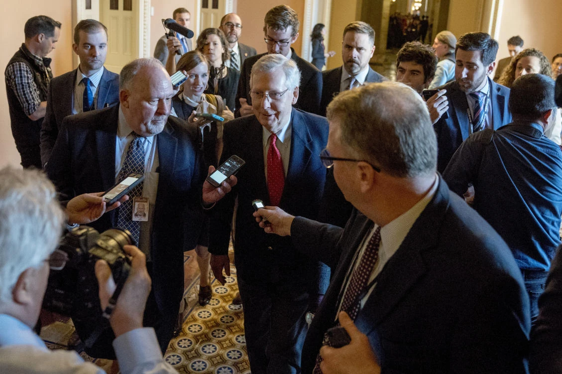 Above, Senate Majority Leader Mitch McConnell walks to the chamber after a closed-door meeting with Republican lawmakers to advance the stalled GOP overhaul of the tax code, on Capitol Hill in Washington. (AP)