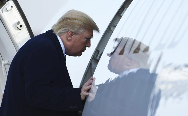 President Donald Trump walks up the steps of Air Force One at Andrews Air Force Base in Maryland states on Saturday, Dec. 2, 2017. Trump is heading to New York to attend Republican fundraisers. (AP Photo/Susan Walsh)