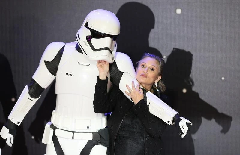 Carrie Fisher poses for cameras as she arrives at the European Premiere of Star Wars, The Force Awakens in Leicester Square, London on December 16, 2015. (Reuters)
