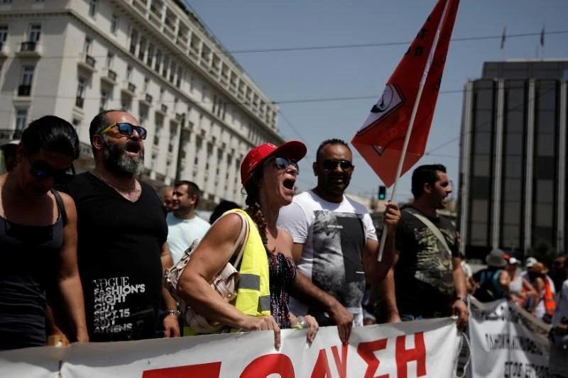 Above, municipal workers shout slogans during a rally against job layoffs in Athens. Greece and its eurozone creditors have reached a preliminary deal on politically sensitive measures covering issues including labor market reforms. (Reuters)