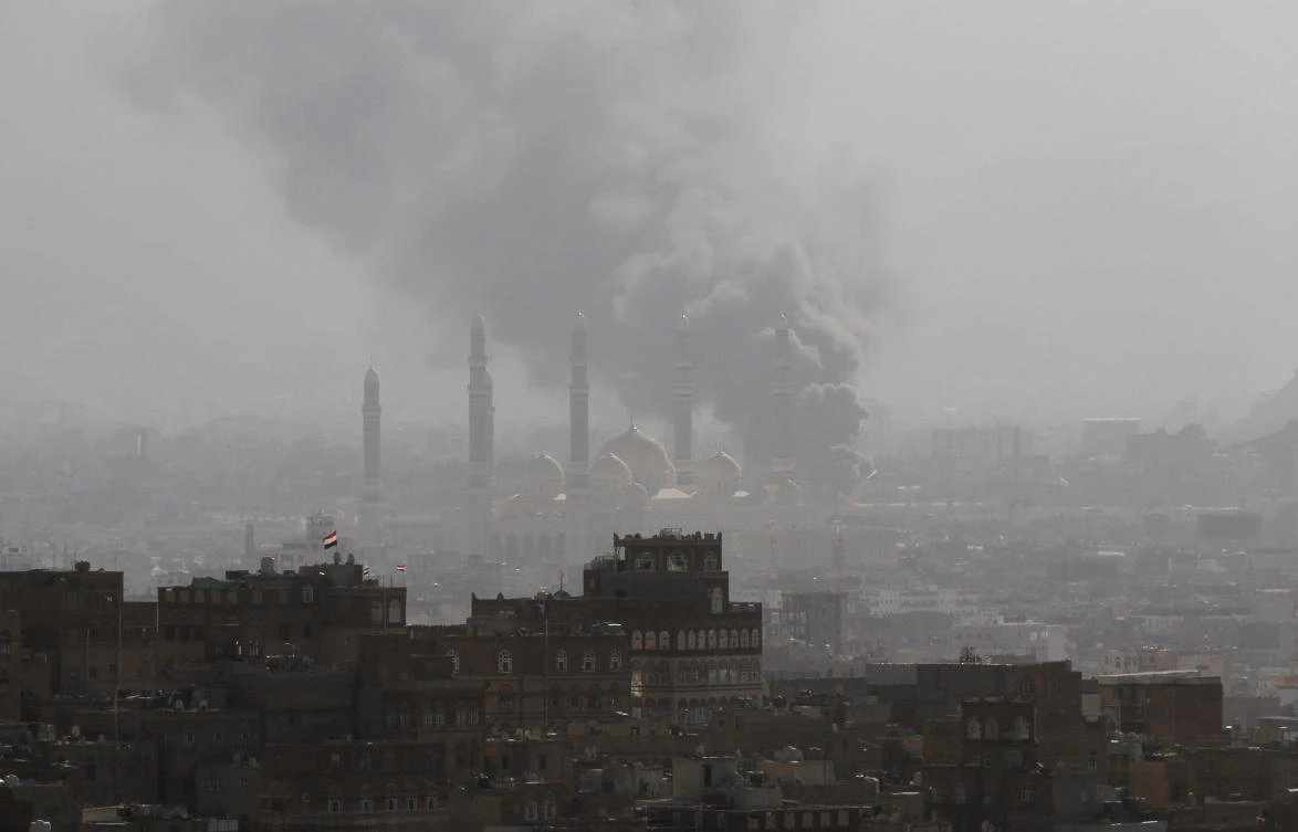 Smoke rises during the battle between former Yemeni President Ali Abdullah Saleh's supporters and the Houthi fighters in Sanaa on December 2. (Reuters)