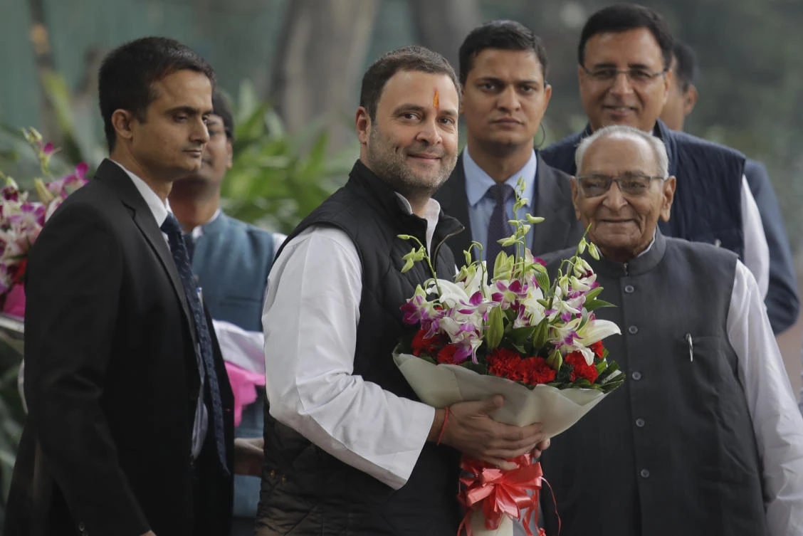 Senior Congress party leaders welcome their party vice president Rahul Gandhi , second left, with flowers as he arrives to file his nomination papers at party headquarters, in New Delhi, India, Monday, Dec. 4, 2017. Gandhi, the scion of India’s Nehru-Gandhi political dynasty, has submitted nomination papers to succeed his mother as president of the main opposition Congress party that governed the country for decades. (AP Photo/Manish Swarup)
