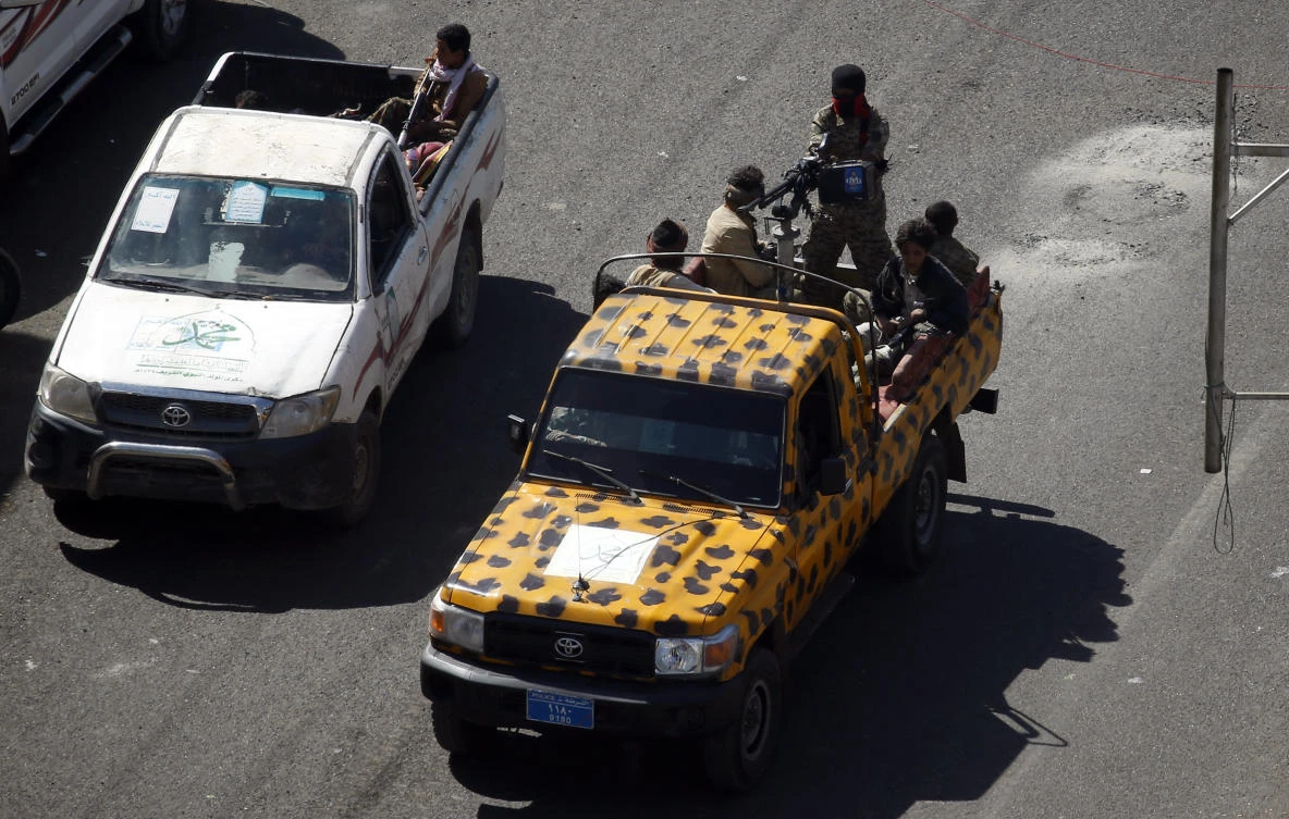 Houthi terrorist fighters patrol a street in the Yemeni capital Sanaa on Dec. 3, 2017, during clashes with supporters of Yemeni ex-president Ali Abdullah Saleh. (AFP/Mohammed Huwais)
