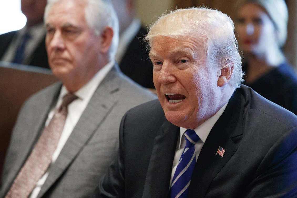 Secretary of State Rex Tillerson listens as President Donald Trump announces that the United States will designate North Korea a state sponsor of terrorism during a cabinet meeting at the White House, Monday, Nov. 20, 2017, in Washington. (AP Photo/Evan Vucci)
