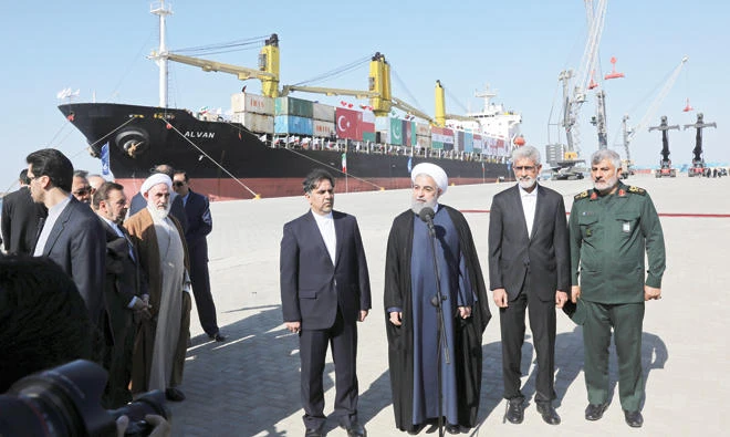 Iranian President Hassan Rouhani, center, speaks during the inauguration of a newly built extension of the port of Chabahar, near the Pakistani border, on the Gulf of Oman, southeastern Iran, Sunday. (AP)
